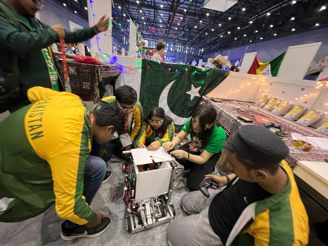 Team Pakistan collaborating around its FIRST Global robot