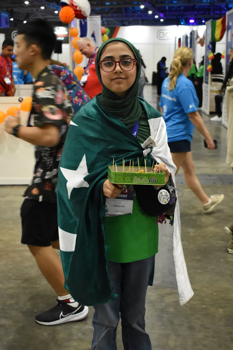 A Team Pakistan participant presenting a robotics project