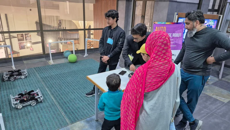 Students taking part in a school robotics demonstration
