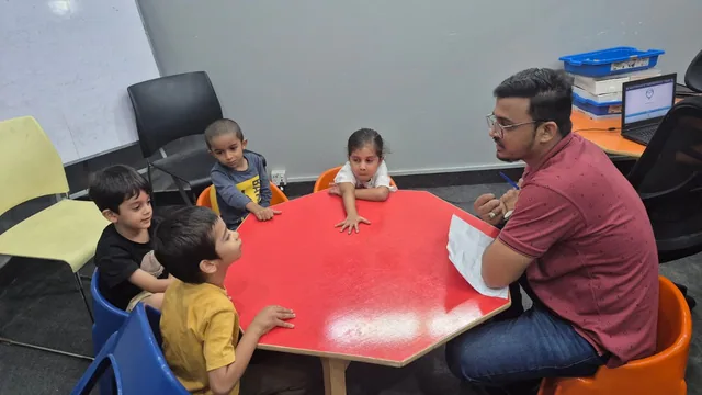Students and an instructor collaborating during a school STEM activity