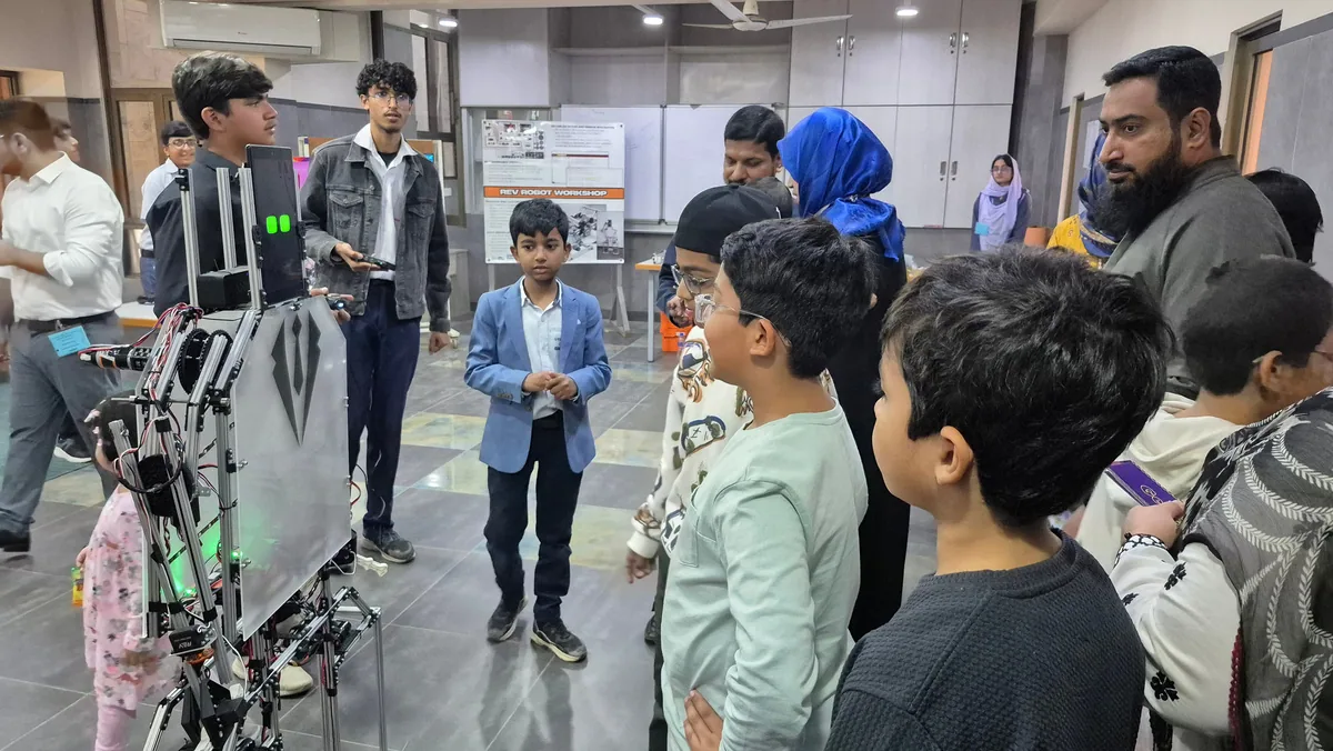 An instructor guiding a practical STEM learning session